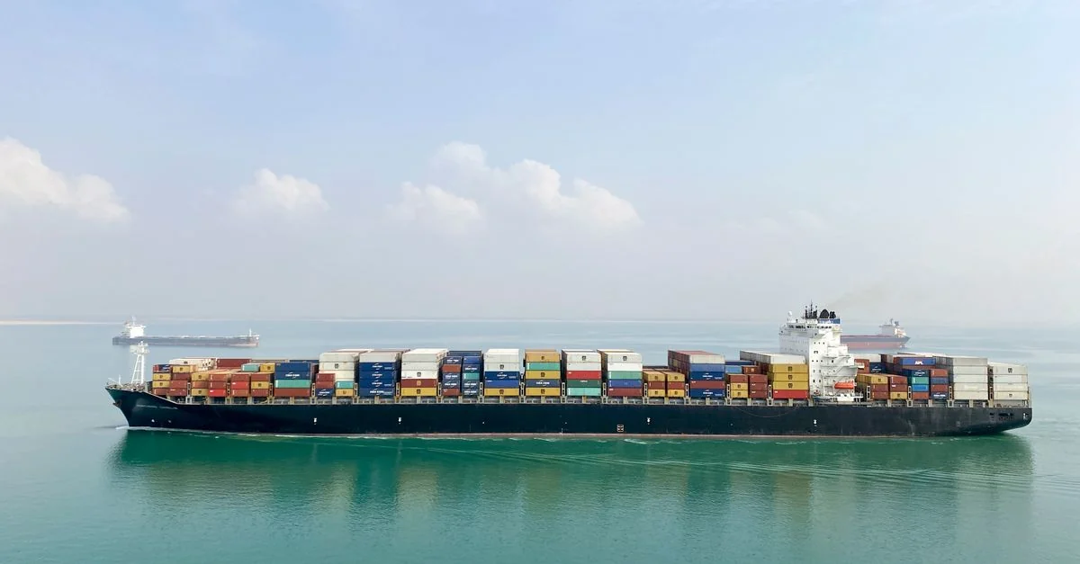 Photograph of a real commercial shipping · container vessel vessel, used for illustration.