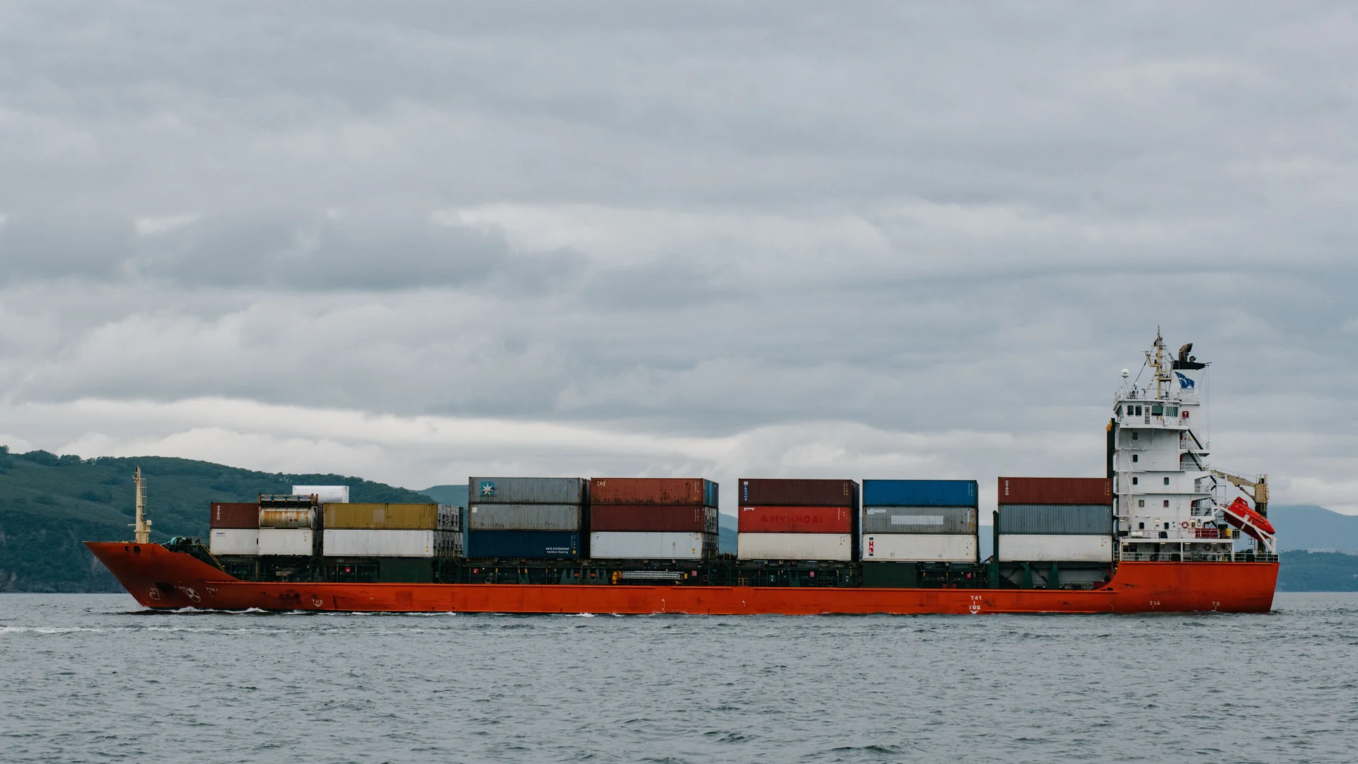 Photograph of a real commercial shipping · container vessel vessel, used for illustration.