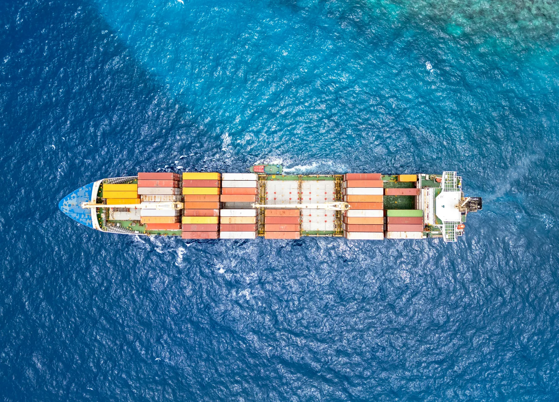 Photograph of a real commercial shipping · container vessel vessel, used for illustration.