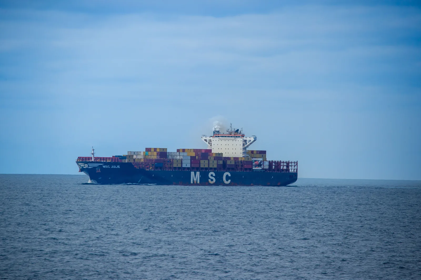 Photograph of a real commercial shipping · container vessel vessel, used for illustration.