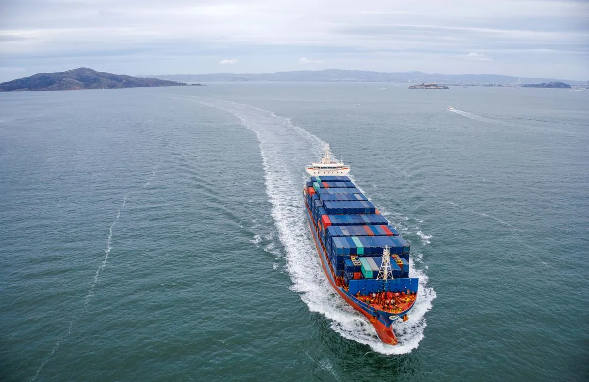 Photograph of a real commercial shipping · container vessel vessel, used for illustration.