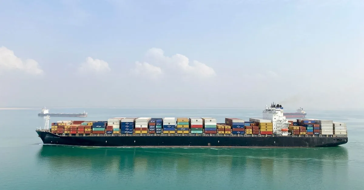 Photograph of a real commercial shipping · container vessel vessel, used for illustration.