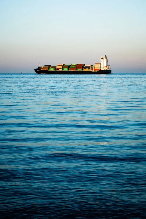 Photograph of a real commercial shipping · container vessel vessel, used for illustration.